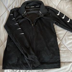 Black Nike running dri-fit long sleeve. With nike checks down the side of sleeve
